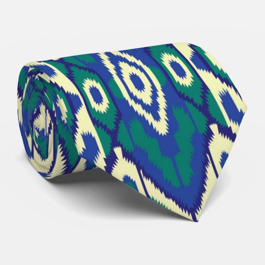 Een blauw en groen patroon met een witte achtergro stropdas (Opgerold)