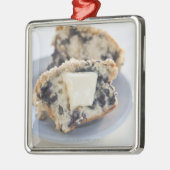 Een blauwbes-muffin met boter metalen ornament (Links)