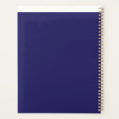 Een blauwe achtergrond met een klok erop planner (Achterkant)