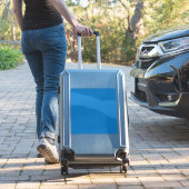 Een blauwe achtergrond met een sticker (Koffer Insitu)