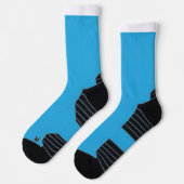 Een blauwe achtergrond met een zwarte en witte kat sokken (Links)