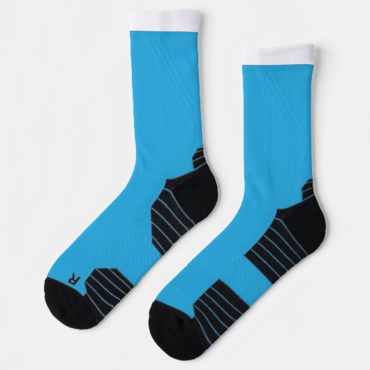 Een blauwe achtergrond met een zwarte en witte kat sokken (Links)