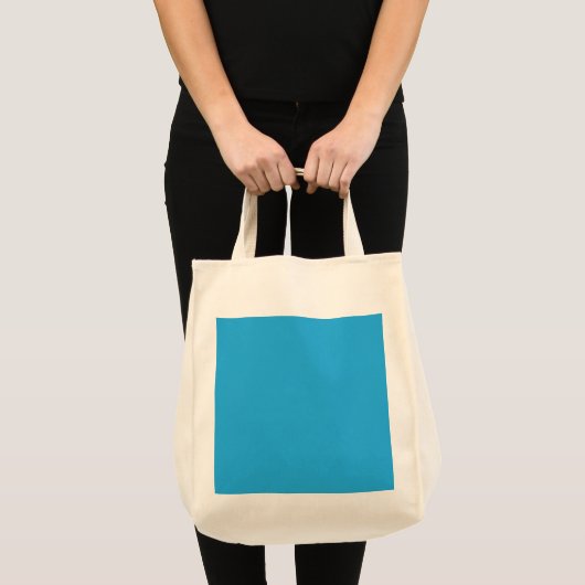 Een blauwe achtergrond met een zwarte en witte kat tote bag (Voorkant (product))