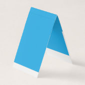 Een blauwe achtergrond met een zwarte en witte kat visitekaartje (Voorkant)