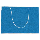 Een blauwe cadeautas met witte handvatten (Achterkant)
