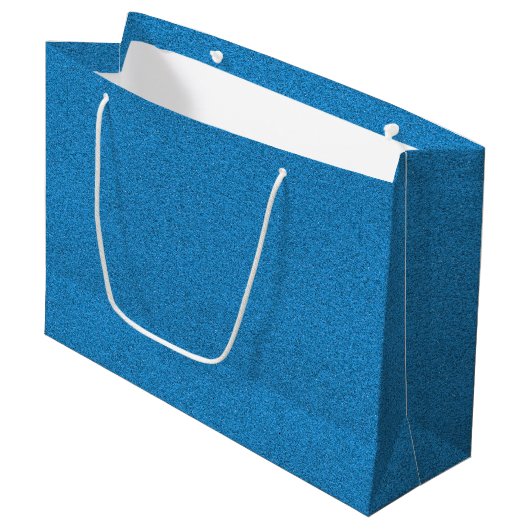 Een blauwe cadeautas met witte handvatten (Voorkant Gekanteld)