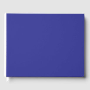 Een blauwe muur met een klok gastenboek
