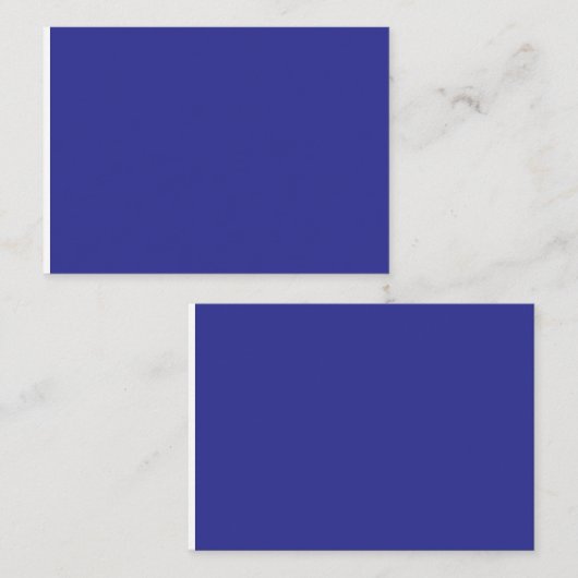 Een blauwe muur met een klok plaatskaartje (Voorkant / Achterkant)