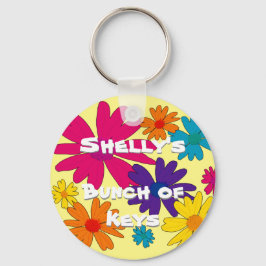 Een bloembed van melkbloemen sleutelhanger