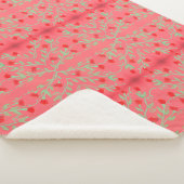 Een bloemige deken met rode munt groen en roze (3/4)