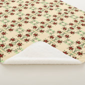 Een bloemige deken met rood en chocoladebruin (3/4)