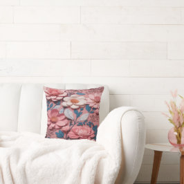 Een bloemmotief met een roze achtergrond kussen