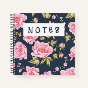 Een bloemmotief met roze bloemen en groen blad notitieboek