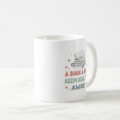 Een boek per dag houdt de realiteit weg koffiemok (Voorkant rechts)