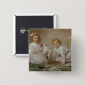 Een broer en zuster spelen, 1915 vierkante button 5,1 cm (Voorkant /achterkant)