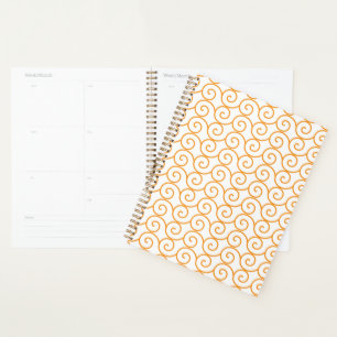 Een bruin en oranje tapijt met een herhalend motie planner