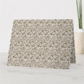 Een bruin tapijt met een geometrisch motief is ged kaart (Achterkant)