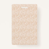 Een bruin tapijt met een ingewikkeld motief ligt o badge (Voorkant)