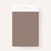 Een bruine muur met een klok erop badge (Achterkant)