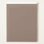 Een bruine muur met een klok erop planner (Achterkant)