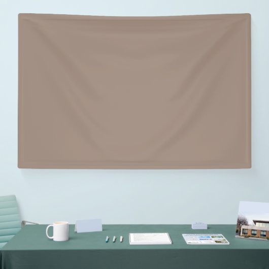 Een bruine muur met een spandoek (Beurs)