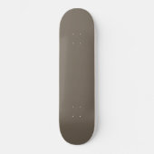 Een bruine muur met een zwart-witte klok erop persoonlijk skateboard (Voorkant)