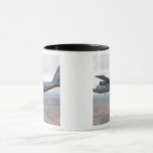 Een C-130 Hercules zwelt door de lucht Mok (Midden)