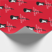 Een cadeau voor kerstfeestdagen met een rotsguitaa cadeaupapier (Hoek)