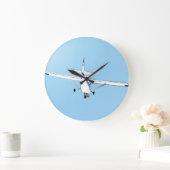 Een Cessna in vlucht Grote Klok (Huis)