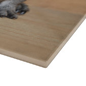 Een Cute Gray Guinee-schop op bruin hout Snijplank (Hoek)