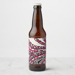 Een decoratief paisley-ontwerp met levendige rode bier etiket