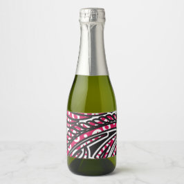 Een decoratief paisley-ontwerp met levendige rode  sparkling wijnetiket