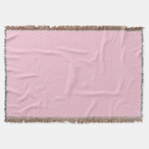 Een decoratieve roze werpdeken met een subtiel 