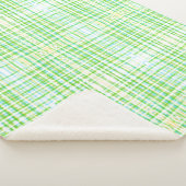 Een deken met een blauw en groen plaid (3/4)