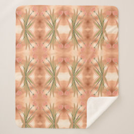 Een deken met een roze en koraal tulpenprint