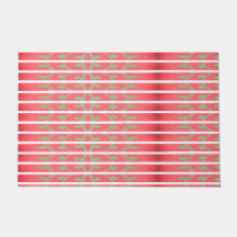 Een designer gooi mat met mintgroen en roze