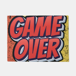 Een deurmat met een spelmotief.