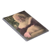 Een echte  kerstman die zijn lijst controleert notitieboek (Rechterzijde)