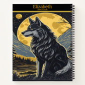 Een eenzame wolf huilt onder het felle volle maanl notitieboek (Achterkant)
