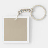 Een effen bruine achtergrond met een gladde, unifo sleutelhanger (Achterkant)
