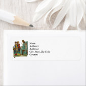 Een engel onderwijst kinderen Kerstmis Etiket (Insitu)