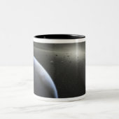 Een enorme asteroïdgordel in een baan rond een ste tweekleurige koffiemok (Center)