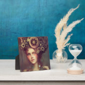 Een fantasievrouw met steampunk tandwielen op haar fotoplaat (Insitu)