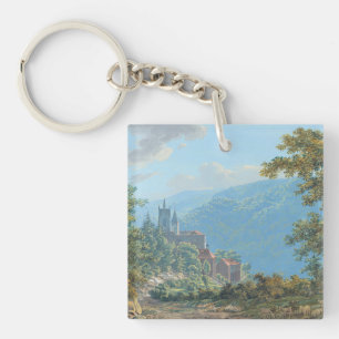 Een fort in een berglandschap bij zonsopgang sleutelhanger