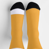 Een gele achtergrond met een sokken (Top)