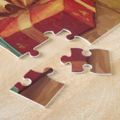 Een gemberkitten slaapt bij een verlichte open haa legpuzzel (Zijkant)