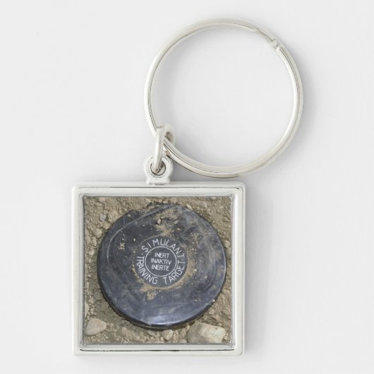 Een gesimuleerde landmijn sleutelhanger (Voorkant)