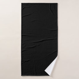 Een gestructureerd zwart oppervlak met subtiel kor badhanddoek