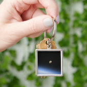 Een gigantische maan zichtbaar boven de atmosfeer sleutelhanger (Hand)