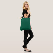 Een gladde, effen donkergroene textuur tote bag (Op model)